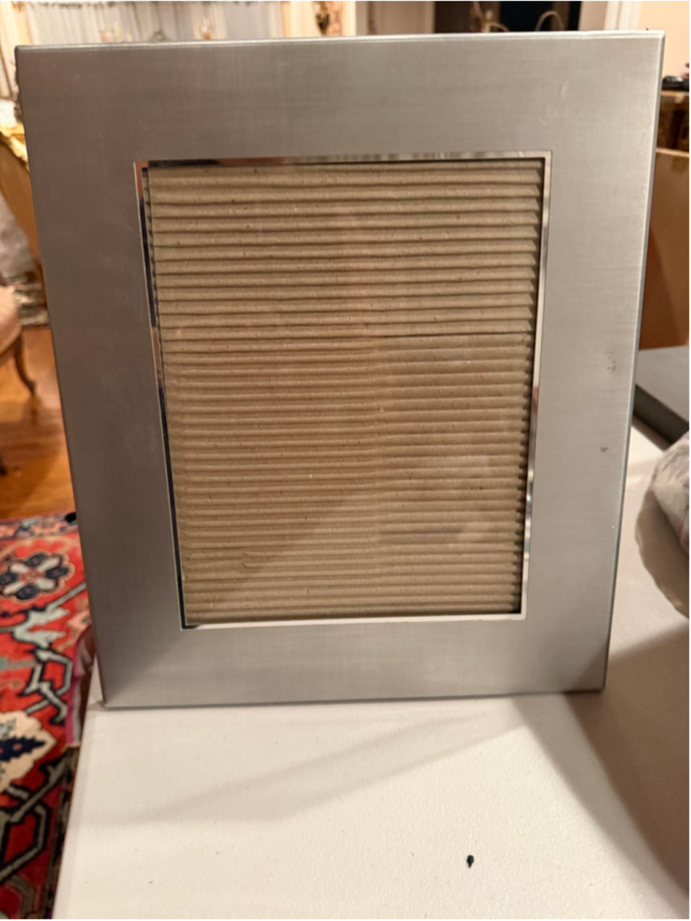Silver metal picture frame with horizontal ridges #metallic #decorative
Few ding